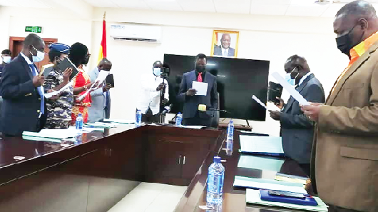 Dr. Yaw Osei Adutwum (3rd from right) swearing in the board