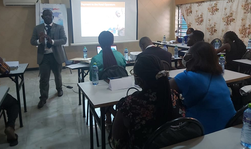Mr Daniel Opoku-Agyemang, Member of Client Officers of the Social Security and National Insurance Trust (SSNIT), taking participants through some of the lessons.