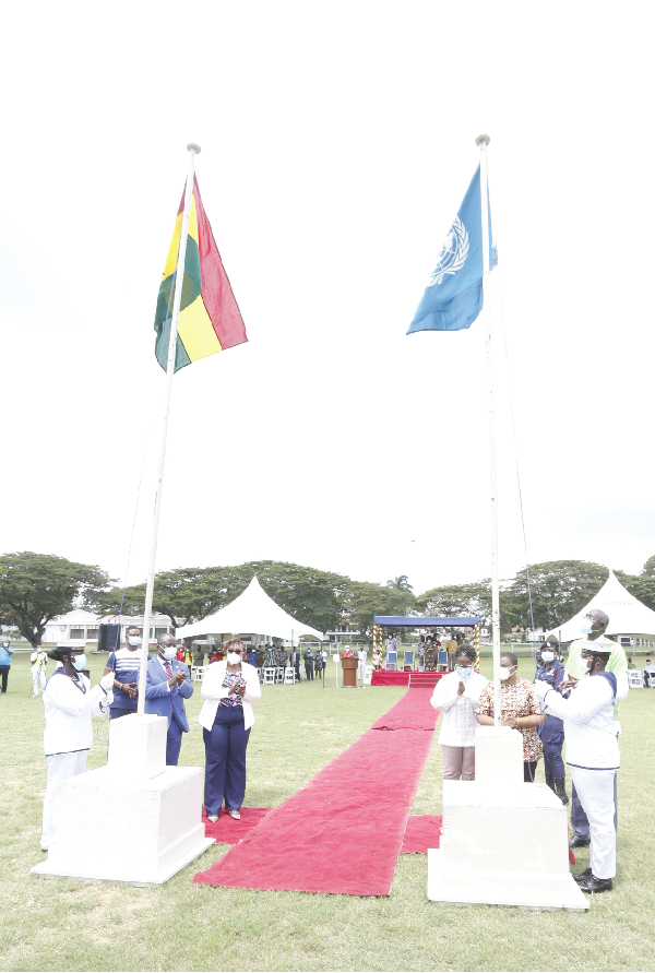 Ms Ifoema Charles-Mowumba (2nd from right), a Director at the United Nations Office for Project Services, hoisting the United Nations flag as Mrs Mavis Hawa Koomson (3rd from left), Minister of Fisheries and Aquaculture and Mr Yaw Frimpong Addo (left), a Deputy Minister of Food and Agriculture, look on. Picture: NII MARTEY M. BOTCHWAY