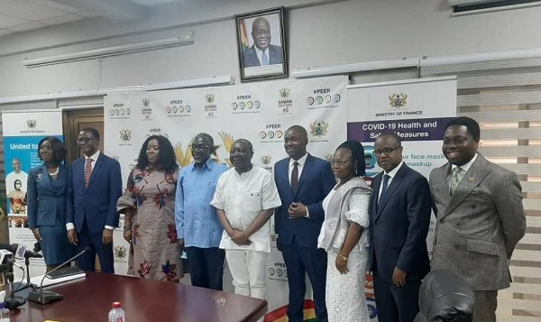Mr Ken Ofori-Atta (middle), in a group photograph with the newly inaugurated board of the MIIF. Those with them include Prof.Douglas Boateng(4th right), the Chairman, and Mr Edward Nana Yaw Koranteng(4th left), CEO of MIIF.