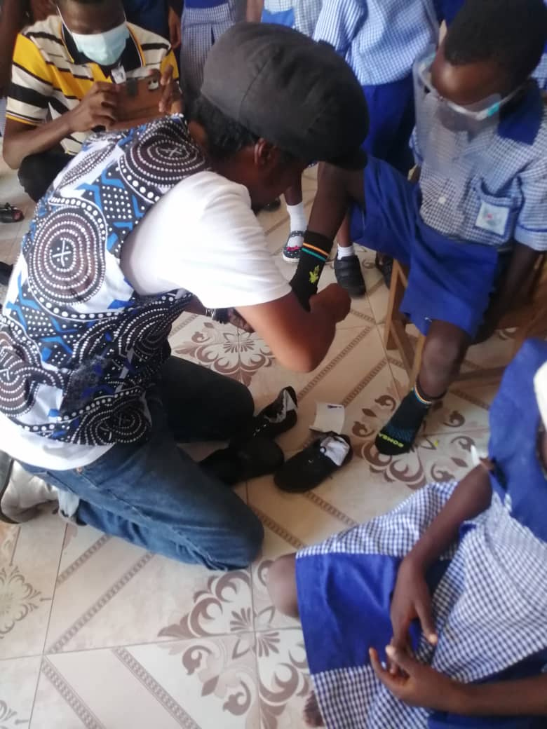Toco Charity, Zormelo distributes shoes in Accra