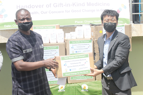 Mr Patrick Kuma-Aboagye (left), Director-General of Ghana Health Service, receiving the items from Mr Ilwon Seo, Managing Director of Good Neighbors Ghana, in Accra. Picture: Patrick Dickson 