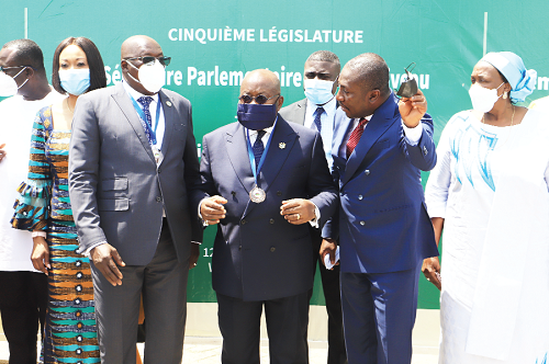 President Akufo-Addo (middle) interacting with Mr Alexander Afenyo-Markin (2nd from right), MP for Effutu, at the opening session the extraordinary session of the ECOWAS Parliament. With them is Dr Sidie Mohamed Tunis, Speaker, ECOWAS Parliament