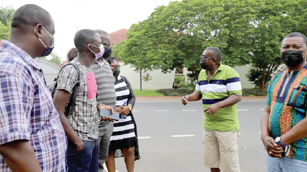 Mr. Tony Asare (2nd from right), a development consultant, speaking to some journalists of the Daily Graphic. With him is Mr. Kobby Asmah (right), Editor, Daily Graphic