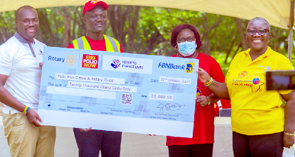  Mr Victor Yaw Asante (left), CEO, FBN Bank Ghana, presenting a dummy cheque to  Nana Yaa Pokua Siriboe (right), Chairperson, Ghana National Polio plus Committee, Rotary International. Picture: Benedict Obuobi