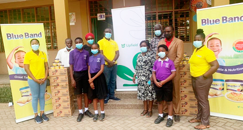 Some officials of Upfield during a donation to a school