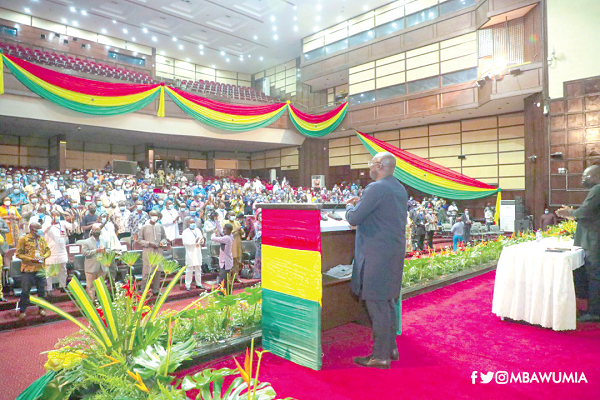 Dr Mahamudu Bawumia (right) addressing the MMDCEs