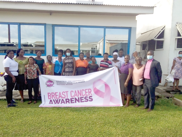 Mr Richard Kwame Kumi (right), the Eastern Regional Officer of the ICU, with some female workers of the Intravenous Infusions Limited.
