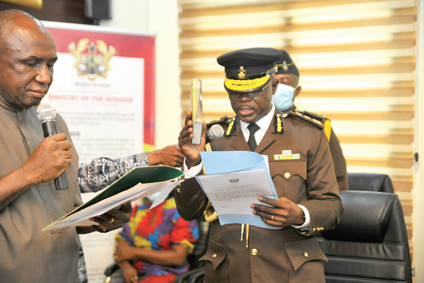 Mr Ambrose Dery (left), Minister for the Interior admistering the Oath of office to Mr Isaac Kofi Egyir, Director-General of the Ghana Prisons Service. Picture: EMMANUEL QUAYE