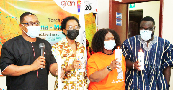 From left: Dr. Nii Nortey Hanson Nortey, Country Coordinating Mechanism of Global Fund Vice-Chair; Mrs. Angela Trenton-Mbonde of the UNAIDS Ghana; Mrs. Cecilia Senoo, Member of the Developing Country NGO Delegation to the Global Fund Board, and Jerry Amoah-Larbi of the Ghana TB Voice Network holding the Global Fund caravan torch