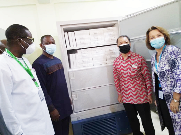 Mr Kwabena Boadu Oku-Afari (left), the Chief Director of the Ministry of Health; Dr Patrick Kuma-Aboagye (2nd from left), Director-General, GHS; Mr Tsutomu Himeno (2nd from right), Japanese Ambassador to Ghana, and Ms Anne-Claire Dufay (right), the UNICEF Representative in Ghana, standing by one of the vaccine freezers