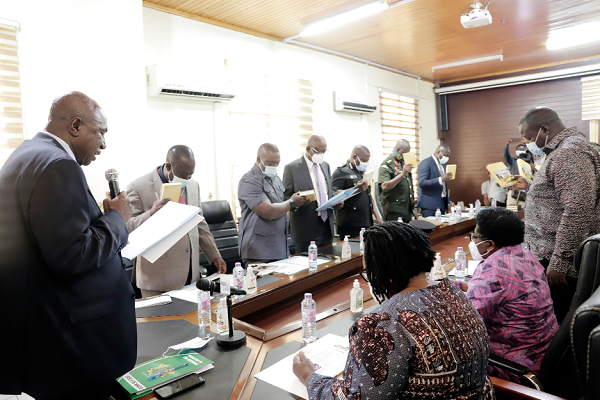 Mr Ambrose Dery (left), Minister for the Interior, swearing in the Ghana National Commission on Small Arms and Light Weapons Board into office in Accra. Picture: EDNA SALVO-KOTEY