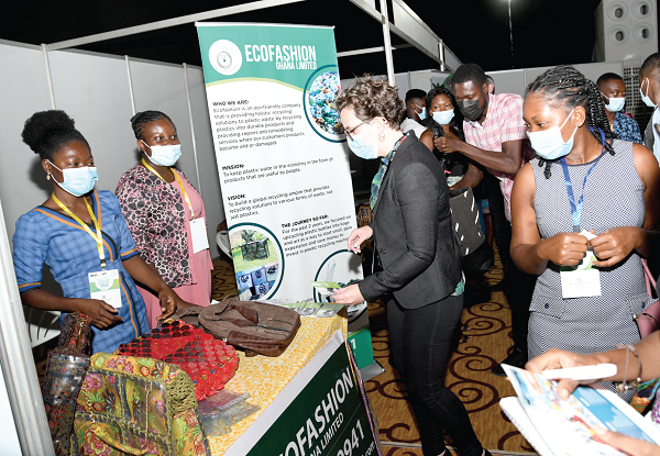 Some participants in the seminar admiring some Ghanaian made products displayed at the venue. Picture: EBOW HANSON