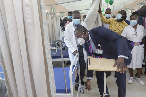 Dr Opoku Ware Ampomah (right), Chief Executive Officer, Korle Bu Teaching Hospital, examining one of the beds at the Orthopaedic Ward D of the hospital during a tour of the facility. Looking on is Dr Frederick Kwarteng (left), Head of Orthopaedics Department of the hospital  Picture: EDNA SALVO-KOTEY