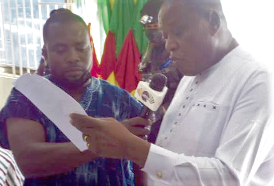 Mr James Cecil Yanwube (right), DCE for Tatale/Sanguli, delivering his acceptance speech