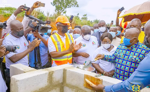 • President Akufo-Addo laying a brick at the commissioning of the Agenda 111 project