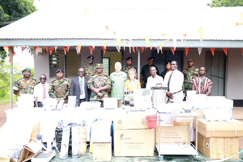  Brig. Gen. Moses Mohammed Aryee (middle), General Officer Commanding the Northern Command, with the donors after the presentation of the items