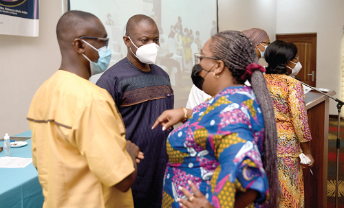  Dr Patrick Kuma-Aboagye (middle), Director-General, GHS, interacting with Dr Lawrence Osei-Tutu, KATH, and Dr Lydia Dsane-Selby, NHIA