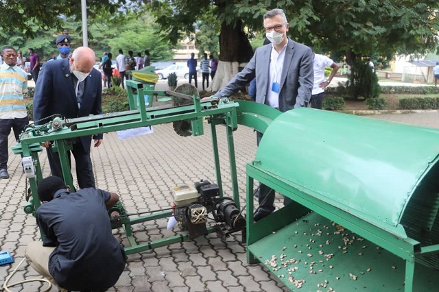 Mr. Helmut Stein (standing extreme left), and Mr. Joachim Lindenau (right), both consultants with Clean-Africa e.V, observing how the Solar-powered Cocoa pod breaker and separation machine works. Picture Emmanuel Baah