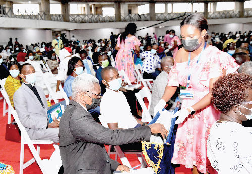 Some attendees giving offering towards the construction of the National Cathederal after the launch. Picture: EBOW HANSON