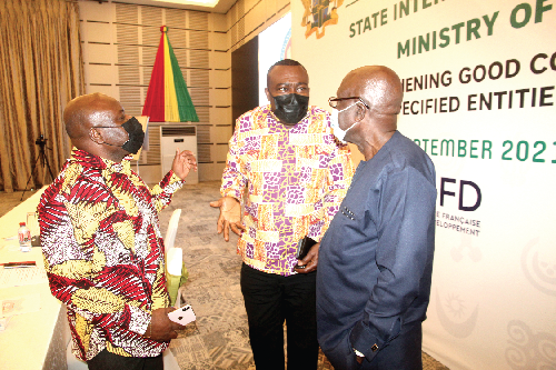 Mr Stephen Asamoah-Boateng (middle), the Director-General of the State Interest and Governance Authority, interacting with Mr Ishmael Yamson (right), Chairman of Ishmael Yamson and Associates,  and Mr Joseph Cudjoe (left), Minister of Public Enterprises. Picture: ESTHER ADJEI