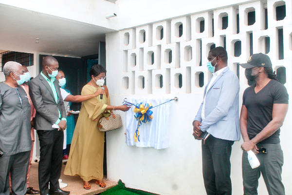 Justice Sophia Akuffo, the Chairperson of the COVID-19 National Trust Fund, cutting the tape to open the new facility