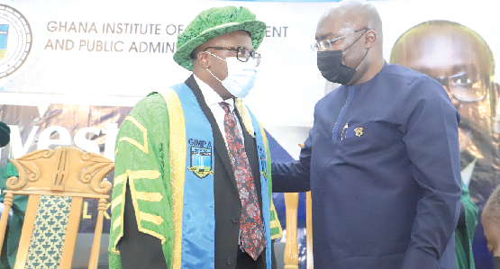 Vice-President Dr Mahamudu Bawumia (right) congratulating Prof. Samuel Kwaku Bonus, Rector, Ghana Institute of Management and Public Administration, after the investiture at Legon. Picture: SAMUEL TEI ADANO