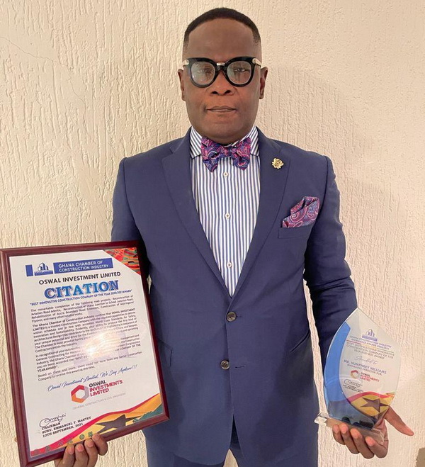 Mr. William Awuletey- Williams, Group Chairman of OSWAL Investment Group Ltd displaying his Citation and plaque after the awards.