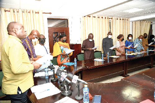  Dr Ibrahim Mohammed Awal (left), Minister of Tourism, Arts and Culture, administering the oath to the board members of the Ghana Tourism Authority (GTA). Picture: EBOW HANSON