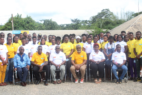 A group photograph of beneficiaries and officials from SOS Children's Village and DHL Ghana.