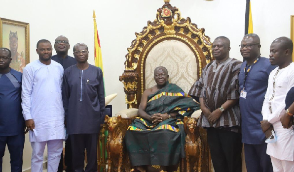 Otumfuo Osei Tutu II (seated), the Asantehene with the leadership of MIIF. Among them is Mr Yaw Baah, (3rd right), CEO of MIIF. Picture: EMMANUEL BAAH