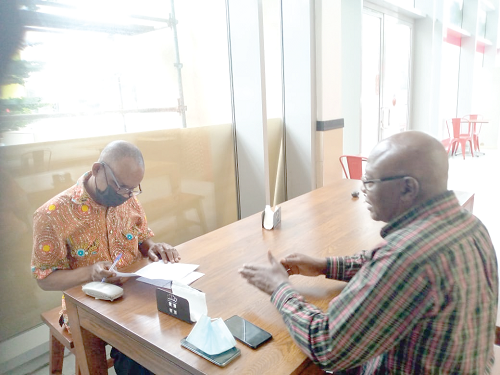 Mr Opong-Fosu (right) speaking to Kwame Asare Boadu, Daily Graphic’s Deputy News Editor