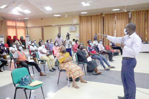 Dr Joshua Arthur (right), public health specialist at the Komfo Anokye Teaching Hospital, addressing the workshop
