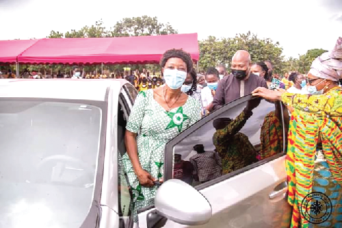 Mrs Obidieh (left), entering her car to take a test drive after being handed the key. With her is Mr Ablakwa (middle), MP for North Tongu