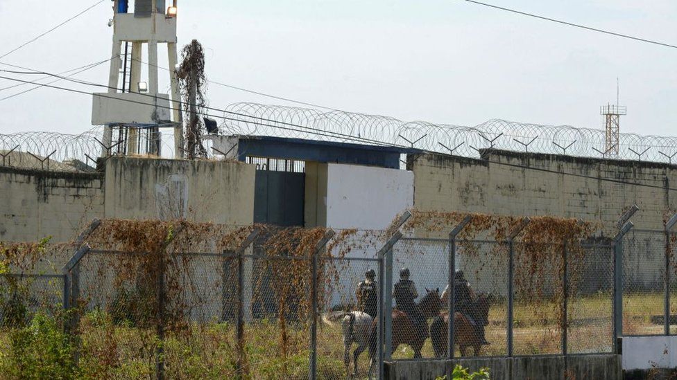Officers on horseback patrolled the perimeter of the prison