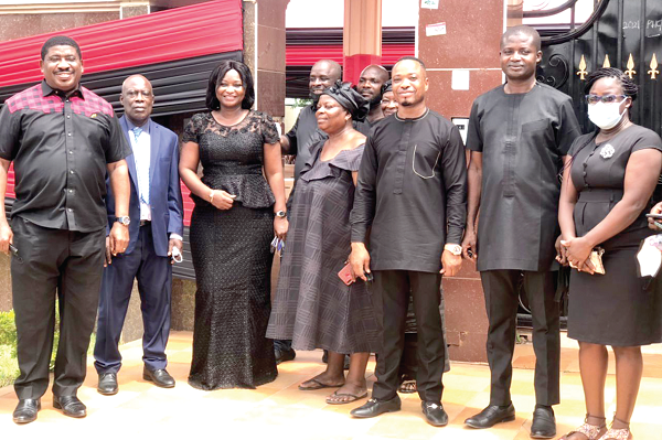 Mrs Justina Margold Assan (3rd from right), the Central Regional Minister, with some family members of late Mrs Benyiwa-Doe
