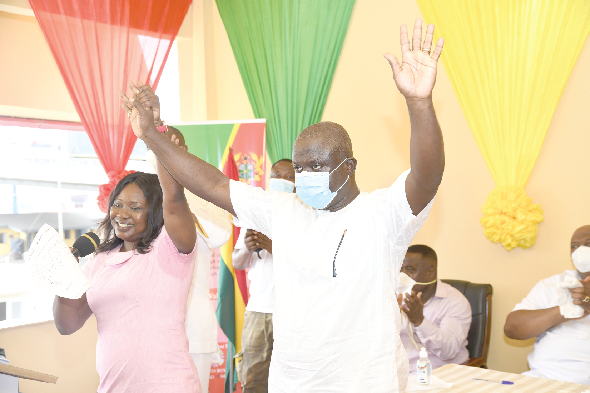 Mr James Samuel Nii Adjei Tawiah (right) being declared as MCE of Korle Klottey  Municipal Assembly by Ms Linda Abban, Municipal EC Officer. Picture: EBOW HANSON