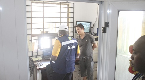  Officials of GRA inspecting the books and tax records of E & A Quarry Limited