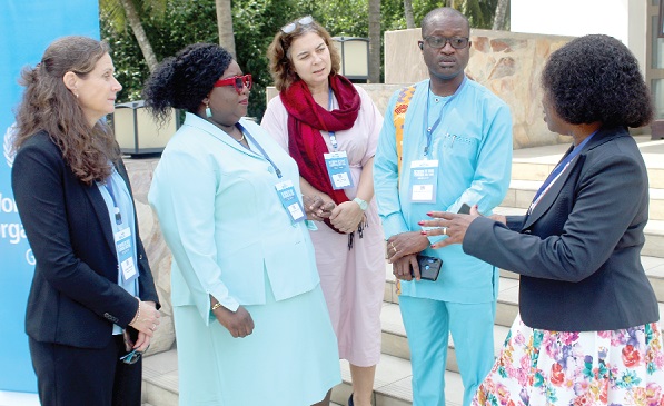 Roseline Doe (right) of the World Health Organisation, explaining a point to Dr Yeboah (2nd from right) and Dr Britwum-Nyarko (2nd from left). With them is Allisyn Moran (left), Maternal Health Lead of the WHO, and Blerta Maliqi (middle), MCA Team Lead, Strategy and Programmes.   Picture: ESTHER ADJORKOR ADJEI