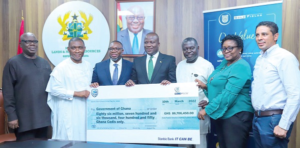 Joshua Mortoti (3rd from left), the acting Executive Vice-President and Head of Goldfields West Africa, presenting the dummy cheque to Samuel Abu Jinapor (middle), Minister of Lands and Natural Resources 