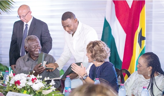 Rev Dr Lawrence Tetteh (3rd from right), President of the Worldwide Miracle Outreach,  presenting the Knight Cross of the Order of Merit of Hungary to former President John Agyekum Kufuor. Also in the photograph are Claudia Turbay Quintero (2nd from right), Dean of the Diplomatic Corps, Barbara Tetteh (right), wife of Rev. Tetteh, and Tamás Fehér (left), Hungarian Ambassador to Ghana