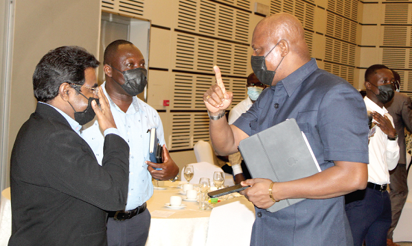 Ato Afful (right), MD of Graphic Communications Group Limited, interacting with some participants after the meeting.  Picture: ESTHER ADJORKOR ADJEI 