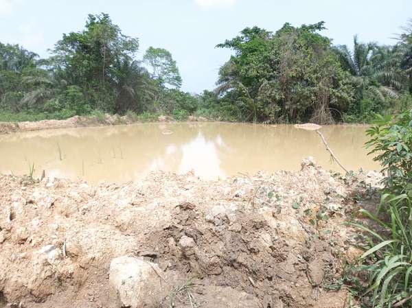 Open galamsey pits swallow community members