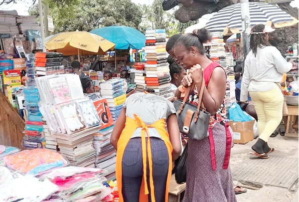 A parent purchasing some books for her child