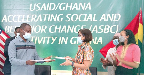  Dr Patrick Kuma-Aboagye (left), Director-General, Ghana Health Service, exchanging documents with Dr Zohra Balsara, Health, Population and Nutrition team lead, USAID Ghana, after signing the MoU