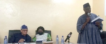  Prof. D.D. Kuupole launching the book. With him are Dr Mustapha Abdul-Hamid (left), Chief Executive Officer of the National Petroleum Authority, and Prof. Naana Jane Opoku-Agyemang, a former Vice-Chancellor of the UCC