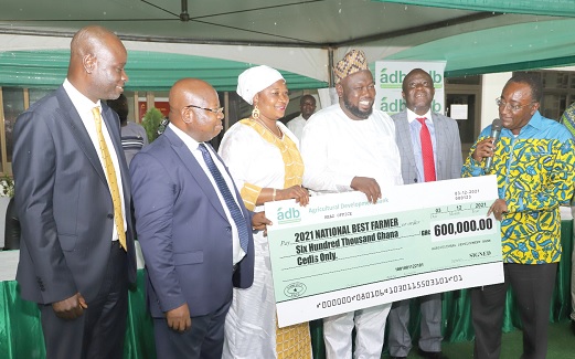 Dr Owusu Afriyie Akoto (right), Minister of Food and Agriculture, presenting the 2021 National Best Farmer award to Alhaji Mohammed Mashud (4th from left) at the ceremony in Accra. Those in the picture include Yaw Frimpong Addo (2nd from right), Deputy Minister of Food and Agriculture; Dr John Kofi Mensah (2nd from left), Managing Director of ADB; Alhassan Yakubu-Tali (left), the Deputy Managing Director of ADB, and Suhuyini Ubaida (3rd from left), wife of the best farmer. Picture: GABRIEL AHIABOR