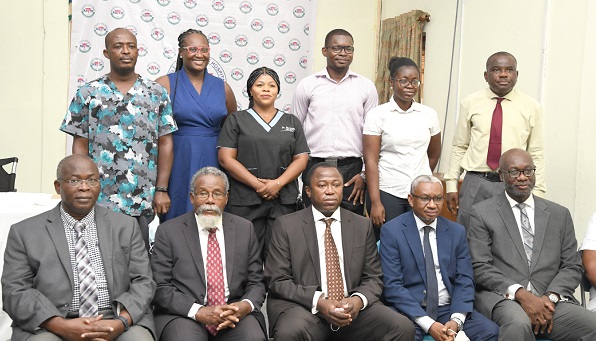 Some management personnel of the Korle Bu Teaching Hospital (seated) with some of the members of the emergency medicine residency after the inauguration. Picture: EBOW HANSON
