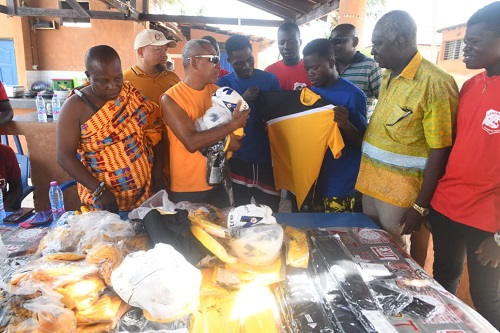 Officials of Sankofa Beach presenting the items to the club