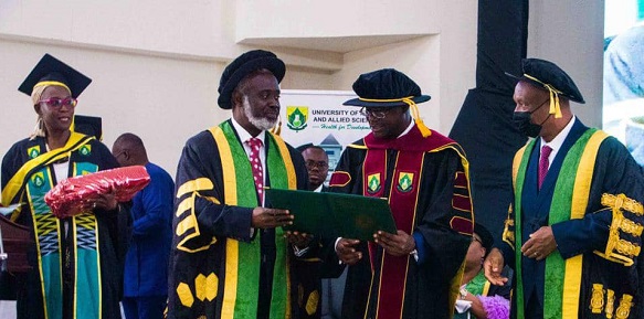    Dr Joseph Siaw Agyepong (2nd from right) receiving his citation of conferment of a Doctor of Science degree from Prof. John Gyapong (2nd from left), the Vice-Chancellor of UHAS, and Justice Victor Jones Mawulorm Dotse (right), the UHAS Council Chairman